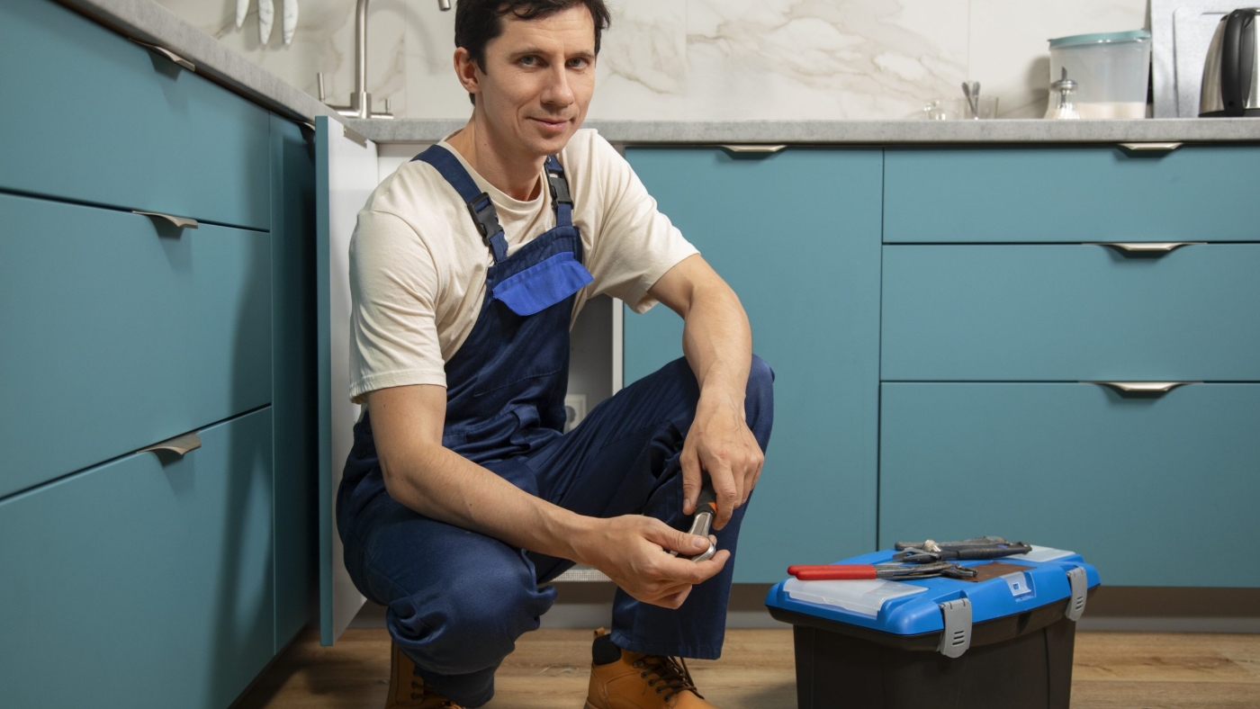 male-plumber-working-fix-problems-client-s-house